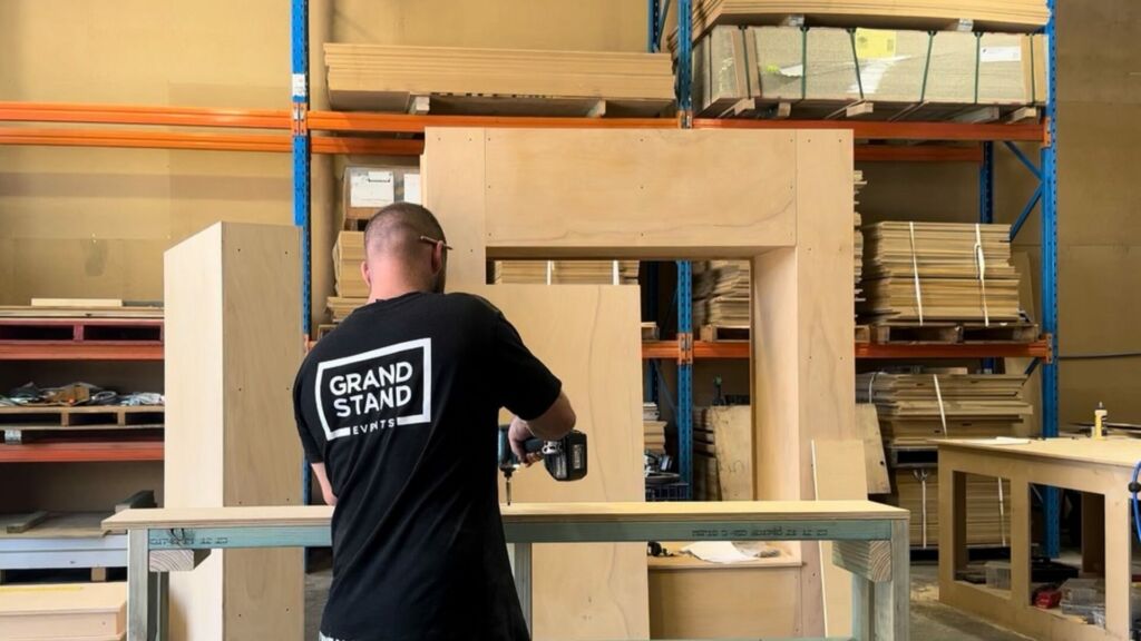 Team member measuring for custom fabrication
