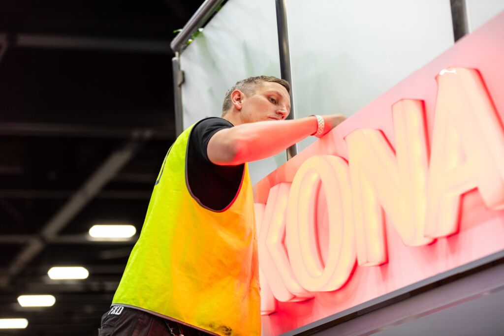 Grand Stand Events Project Manager installing 3D illuminated logo for Konami
