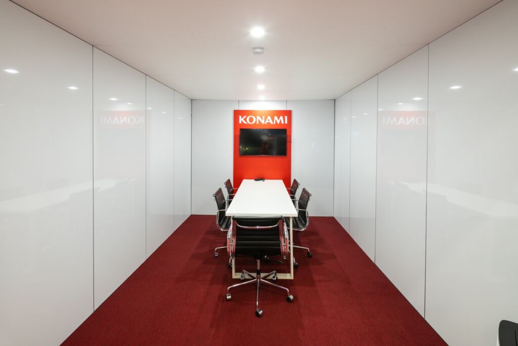 Dibond clad private meeting room with wall mounted LED TV and branded feature wall 3D panel