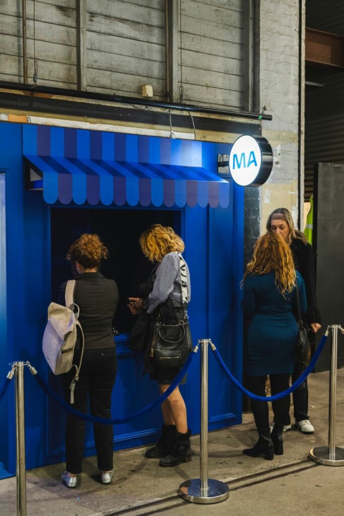 reception desk and branded entry tunnel