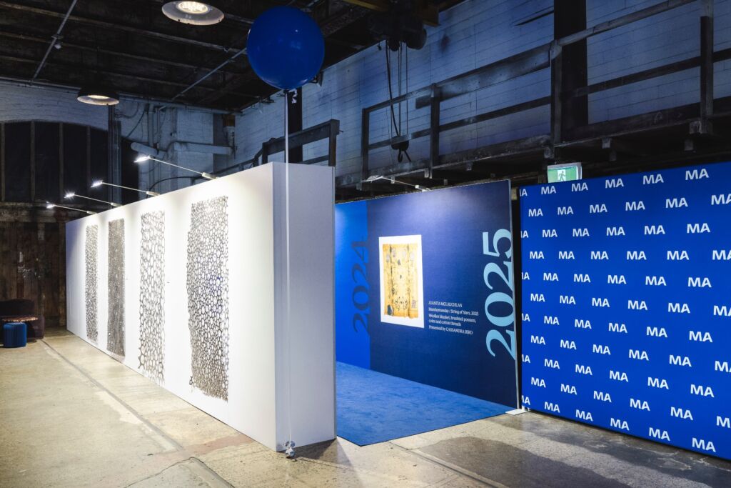 custom walkway and media wall anchoring the space visually between the Elston Room and foyer