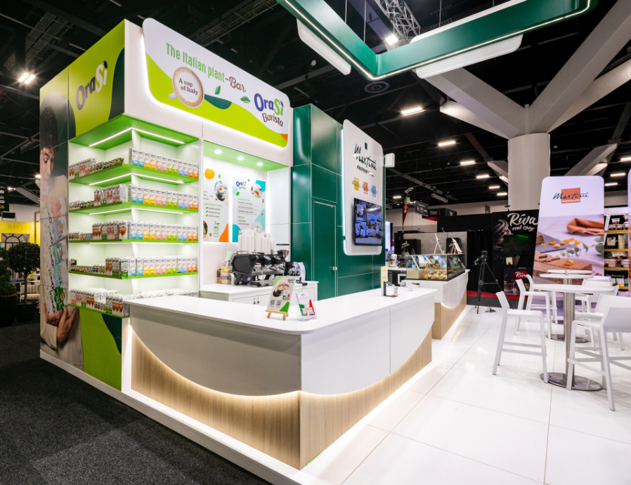 Custom fabricated gelato soft serve display plinth with curved illuminated timber base, built for Martini Gelato at Restaurant & Foodservice Show Australia 2026