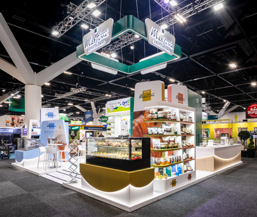 Custom fabricated suspended hanging sign with four-face branding and bespoke double-sided product display shelving unit built for Martini Professional at Restaurant & Foodservice Show Australia 2026